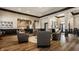 Comfortable lounge area featuring modern decor, seating and an open layout that connects to a kitchen at 3640 Snowdon Dr, Westfield, IN 46074
