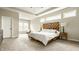 Bright main bedroom featuring a unique headboard, bedside lamps, and plenty of natural light at 3640 Snowdon Dr, Westfield, IN 46074