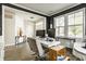 Bright office with multiple computer monitors, a comfortable chair and windows overlooking the yard at 3640 Snowdon Dr, Westfield, IN 46074