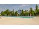 Community outdoor pool with lounge area and view of surrounding townhomes at 3640 Snowdon Dr, Westfield, IN 46074