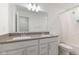 Bathroom featuring a double vanity with a modern countertop, neutral decor, and shower at 3737 Planck St, Danville, IN 46122