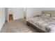 Bedroom featuring neutral carpeting, bedding with a floral design, and access to the bathroom at 3737 Planck St, Danville, IN 46122