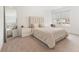 Well-lit bedroom with a large bed, neutral decor, bright windows, and a mirror at 3737 Planck St, Danville, IN 46122