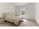 Bright bedroom featuring neutral carpeting, a window, and floral bedding at 3737 Planck St, Danville, IN 46122