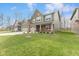 Charming two-story home with green siding, attached garage, and well-manicured lawn at 3737 Planck St, Danville, IN 46122