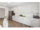 Bright, modern kitchen with white cabinets, stainless steel appliances, and quartz countertops at 3737 Planck St, Danville, IN 46122