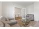 Sitting room featuring neutral tones, plush seating, glass coffee table, and an open entryway at 3737 Planck St, Danville, IN 46122