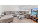 Comfortable living room showcasing a large sectional sofa, glass coffee table, and modern design at 3737 Planck St, Danville, IN 46122