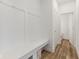 Mudroom featuring built-in bench seating and coat hooks, with wood-look vinyl flooring at 3737 Planck St, Danville, IN 46122