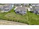 Expansive backyard features a covered patio and pergola seating area surrounded by lush greenery at 3840 Shady Lake Dr, Westfield, IN 46074