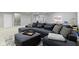 Finished basement featuring a large sectional couch and play area at 3840 Shady Lake Dr, Westfield, IN 46074