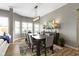 Elegant dining room with modern lighting, stylish decor, and plenty of natural light at 3840 Shady Lake Dr, Westfield, IN 46074
