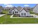 Charming one-story home boasts a well-manicured lawn and tasteful landscaping at 3840 Shady Lake Dr, Westfield, IN 46074