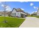 Side view of a charming one-story home boasts attached garage and nice landscape at 3840 Shady Lake Dr, Westfield, IN 46074