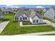 Charming one-story home boasts a well-manicured lawn and tasteful landscaping at 3840 Shady Lake Dr, Westfield, IN 46074