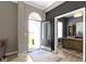 Inviting foyer with an arched transom window above the front door, gray walls, light wood floors and an office to the side at 3840 Shady Lake Dr, Westfield, IN 46074