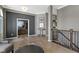 Well appointed foyer featuring neutral paint, light wood floors and an arched doorway to the home office at 3840 Shady Lake Dr, Westfield, IN 46074
