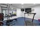 Home gym with weightlifting rack, mirror, television, and treadmill at 3840 Shady Lake Dr, Westfield, IN 46074