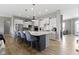 Stylish kitchen boasts a large island with bar seating, and sleek, modern appliances at 3840 Shady Lake Dr, Westfield, IN 46074