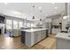 Spacious open kitchen with large center island and stainless steel appliances at 3840 Shady Lake Dr, Westfield, IN 46074