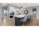 Bright kitchen showcases an island with seating, modern lighting, and updated appliances at 3840 Shady Lake Dr, Westfield, IN 46074