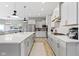 Modern kitchen featuring white cabinets, stainless steel appliances, and center island with pendant lighting at 3840 Shady Lake Dr, Westfield, IN 46074