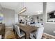 Open floor plan showcasing the kitchen and living room with a large dining room table at 3840 Shady Lake Dr, Westfield, IN 46074