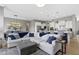 Open-concept living area with a fireplace, comfortable sectional, and seamless access to the kitchen at 3840 Shady Lake Dr, Westfield, IN 46074