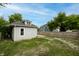 View of backyard featuring home's exterior, fencing, and grassy lawn at 3902 N Capitol Ave, Indianapolis, IN 46208