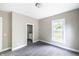 Cozy bedroom with new carpeting, neutral walls, and a sunlit window to the yard at 3902 N Capitol Ave, Indianapolis, IN 46208
