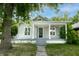 Charming home featuring a welcoming front porch and beautifully maintained landscaping at 3902 N Capitol Ave, Indianapolis, IN 46208