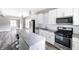 Bright kitchen with stainless steel appliances and ample cabinet space at 3902 N Capitol Ave, Indianapolis, IN 46208