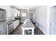 Modern kitchen with stainless steel appliances and a granite island at 3902 N Capitol Ave, Indianapolis, IN 46208