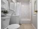 Bathroom with white shower tiles, shower curtain, and white vanity at 3967 N Park Ave, Indianapolis, IN 46205
