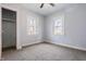 Cozy bedroom with a ceiling fan and two windows at 3967 N Park Ave, Indianapolis, IN 46205