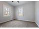 Bright bedroom with two large windows and neutral carpet at 3967 N Park Ave, Indianapolis, IN 46205