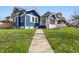 Charming blue two-story home with a well-maintained lawn and inviting walkway at 3967 N Park Ave, Indianapolis, IN 46205