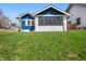 Charming home with a white and blue exterior and a lovely front lawn at 3967 N Park Ave, Indianapolis, IN 46205