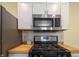 Stainless steel range and microwave, set in front of white subway tile at 3967 N Park Ave, Indianapolis, IN 46205