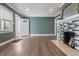 Cozy living room featuring a decorative fireplace, wood floors, and ample natural light at 3967 N Park Ave, Indianapolis, IN 46205