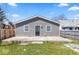 A single-story home featuring a gray siding exterior and a concrete patio at the back at 401 N Swope St, Greenfield, IN 46140
