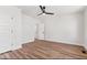 This bedroom has wood floors, neutral paint, and a ceiling fan at 401 N Swope St, Greenfield, IN 46140