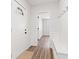 Bright entryway boasts new laminate flooring, wainscoting, coat hooks, and a convenient built-in bench at 401 N Swope St, Greenfield, IN 46140