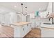 Renovated kitchen boasting a butcher block island, subway tile backsplash, and access to a pantry area at 401 N Swope St, Greenfield, IN 46140