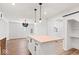 Newly renovated kitchen featuring a butcher block island, modern pendant lighting, and seamless flow into the dining area at 401 N Swope St, Greenfield, IN 46140