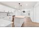 Modern kitchen design with sleek white cabinetry, a butcher block island, and open floor plan concept at 401 N Swope St, Greenfield, IN 46140