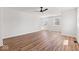 A bright living room featuring hardwood floors, fresh paint, with a modern ceiling fan at 401 N Swope St, Greenfield, IN 46140