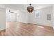 Bright, open living room with hardwood floors, modern lighting, and lots of natural light at 401 N Swope St, Greenfield, IN 46140