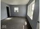 A bedroom with neutral walls and flooring and multiple windows for lots of natural light at 406 W Broadway St, Alexandria, IN 46001