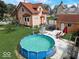 Charming home featuring a round above-ground pool and small backyard, perfect for summer relaxation at 415 E 32Nd St, Indianapolis, IN 46205